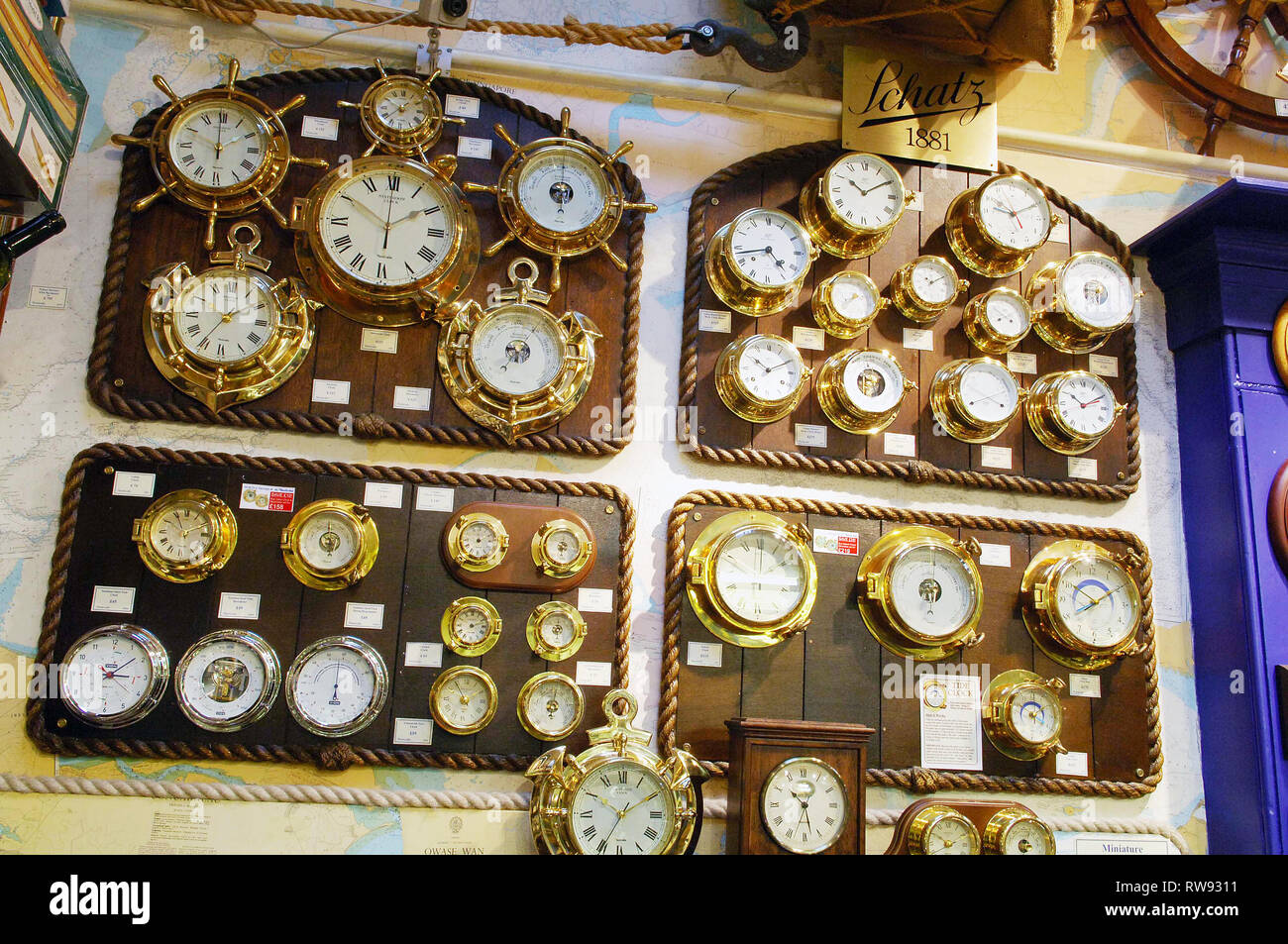 Various ship style clocks for sale in Nauticulia, Covent Garden Stock Photo