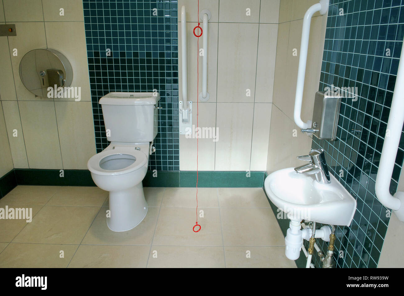 Accessible toilet with hand rails Stock Photo