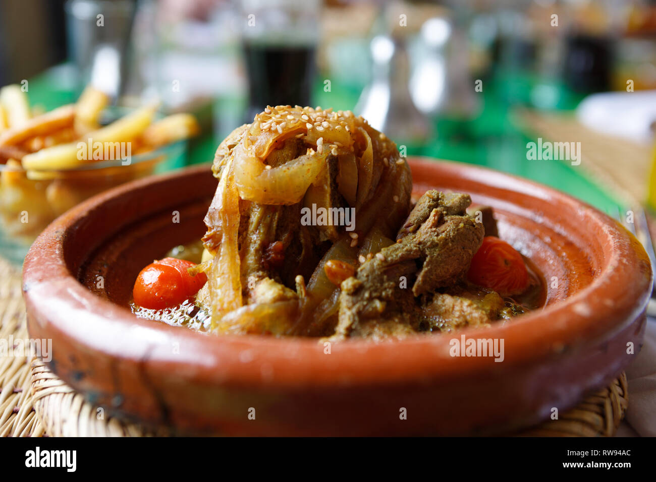 Typical Moroccan dish Lamb tagine with herbs, onions, tomatoes and