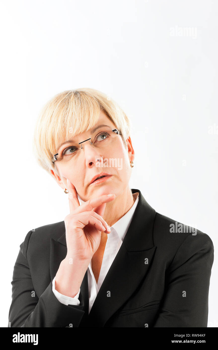 Thoughtful mature businesswoman Stock Photo