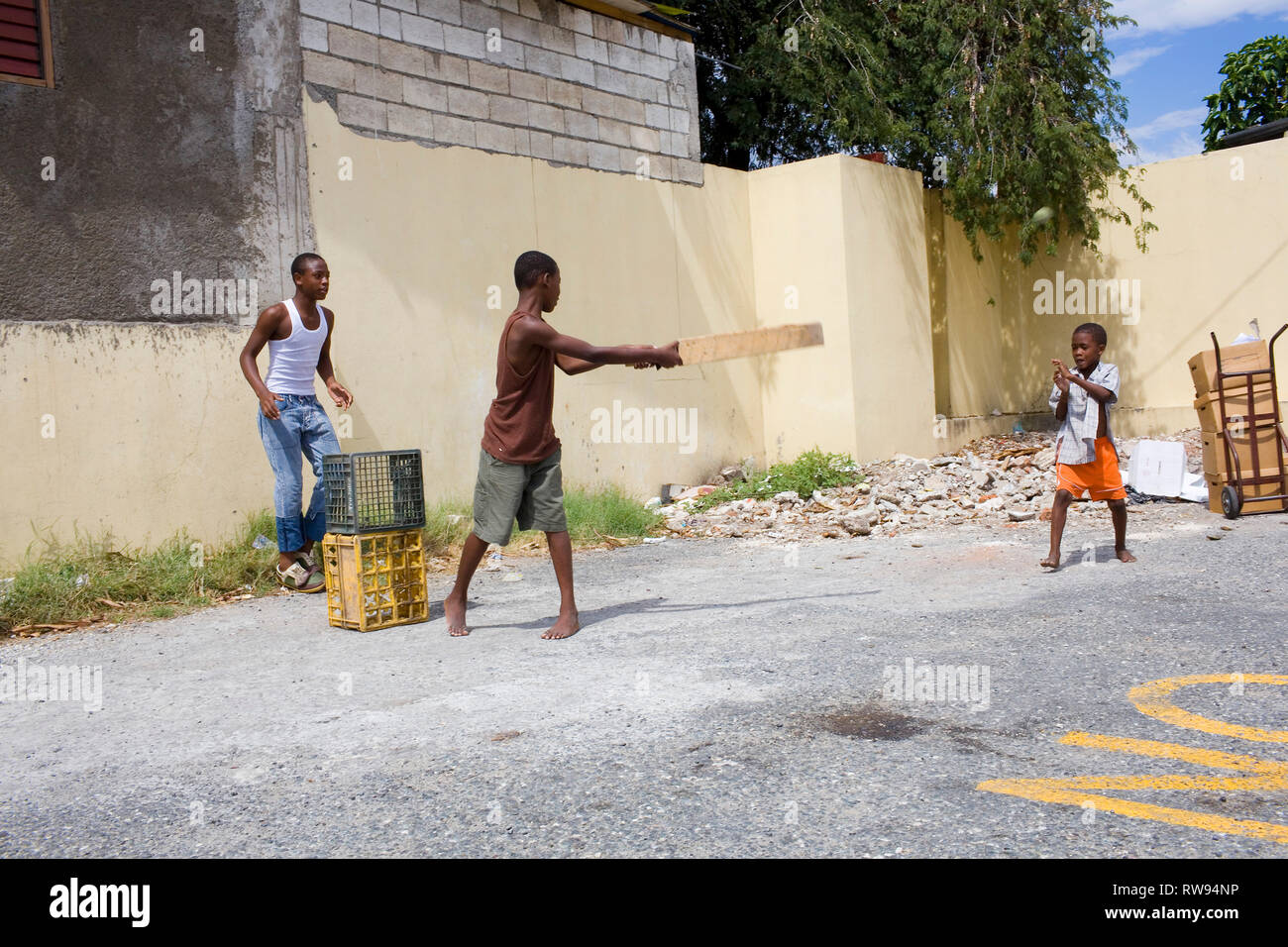Children play cricket in Kingston. Stock Photo