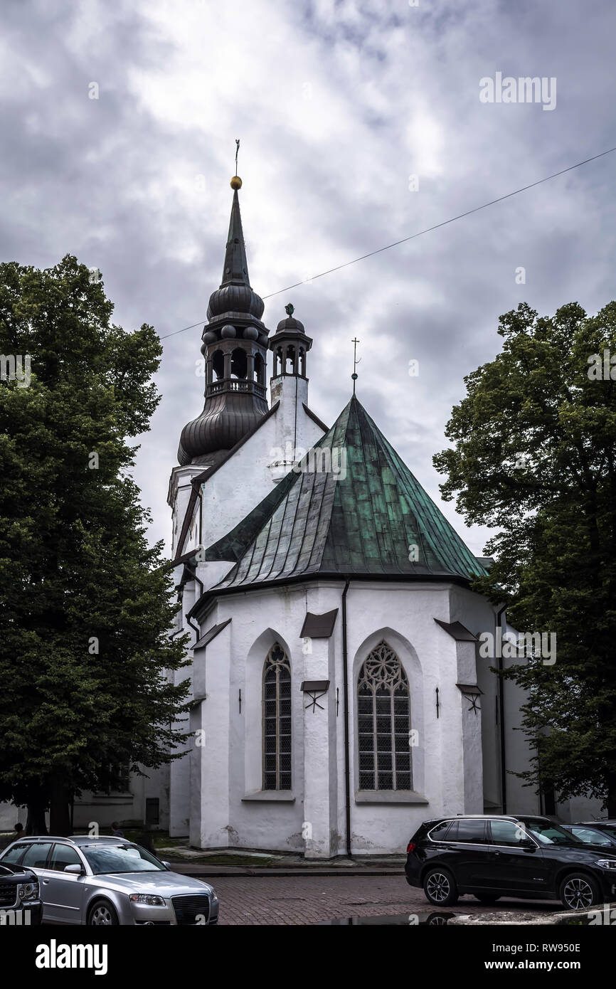 Gothic exterior with Baroque bell tower of lutheran St. Mary's Cathedral, also known as Dome Church, against grey cloudy sky in Tallinn, Estonia. Olde Stock Photo