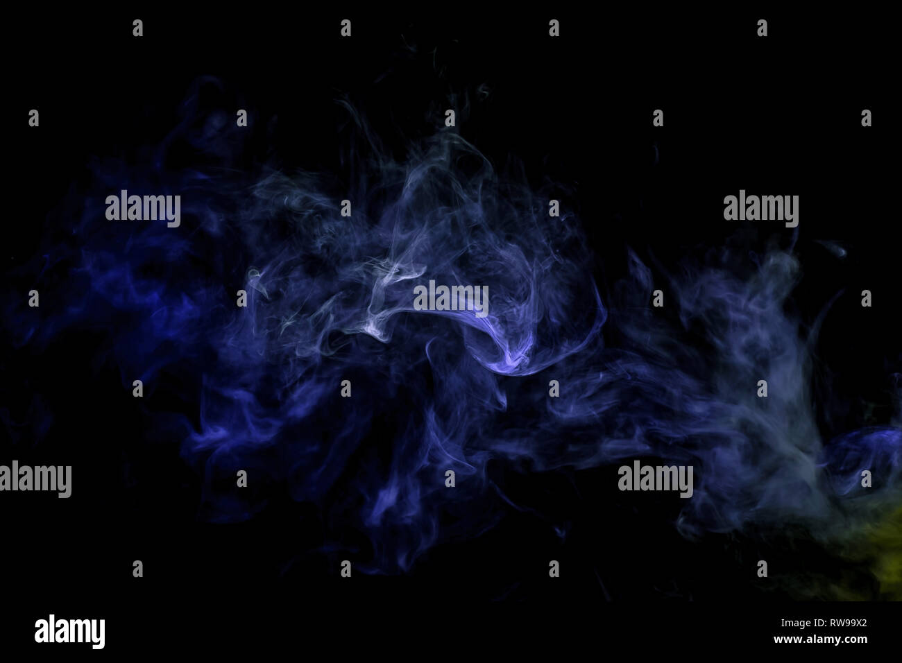 Abstract art blue and green colored smoke on black isolated background ...
