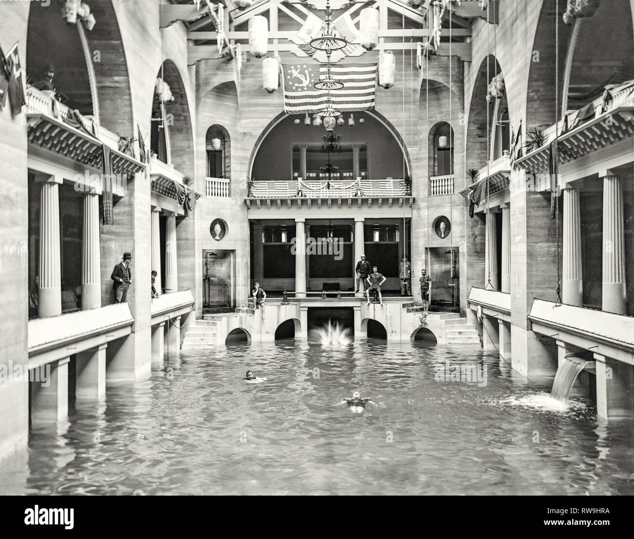 The Casino swimming pool with gentlemen in period swimwear at The Alcazar Hotel, Saint Augustine Florida circa 1890. This was the largest indoor swimming pool in the world fed from natural sulphur water well. Stock Photo
