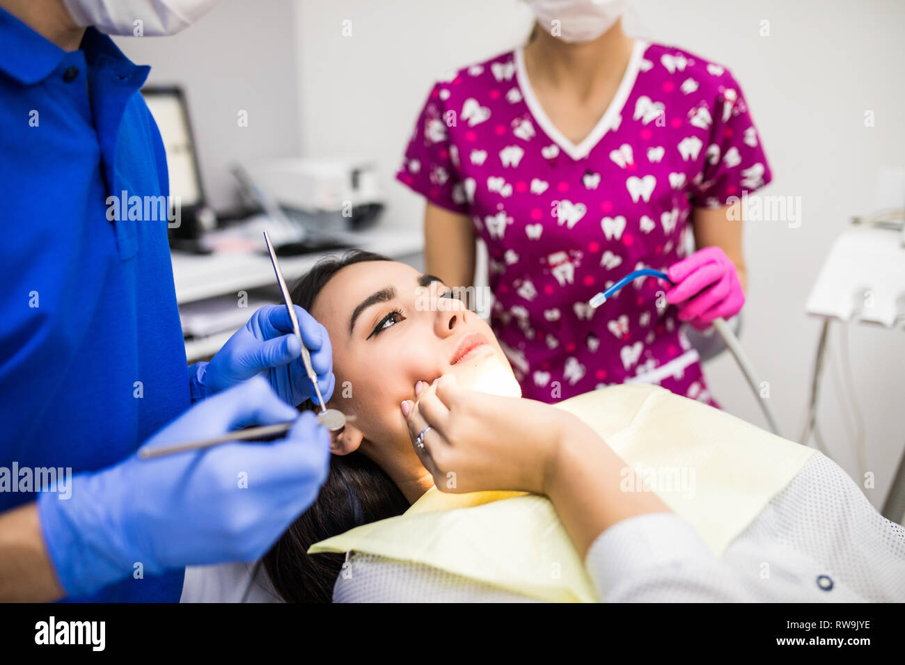 Unhappy patient having a toothache in dental clinic in professional