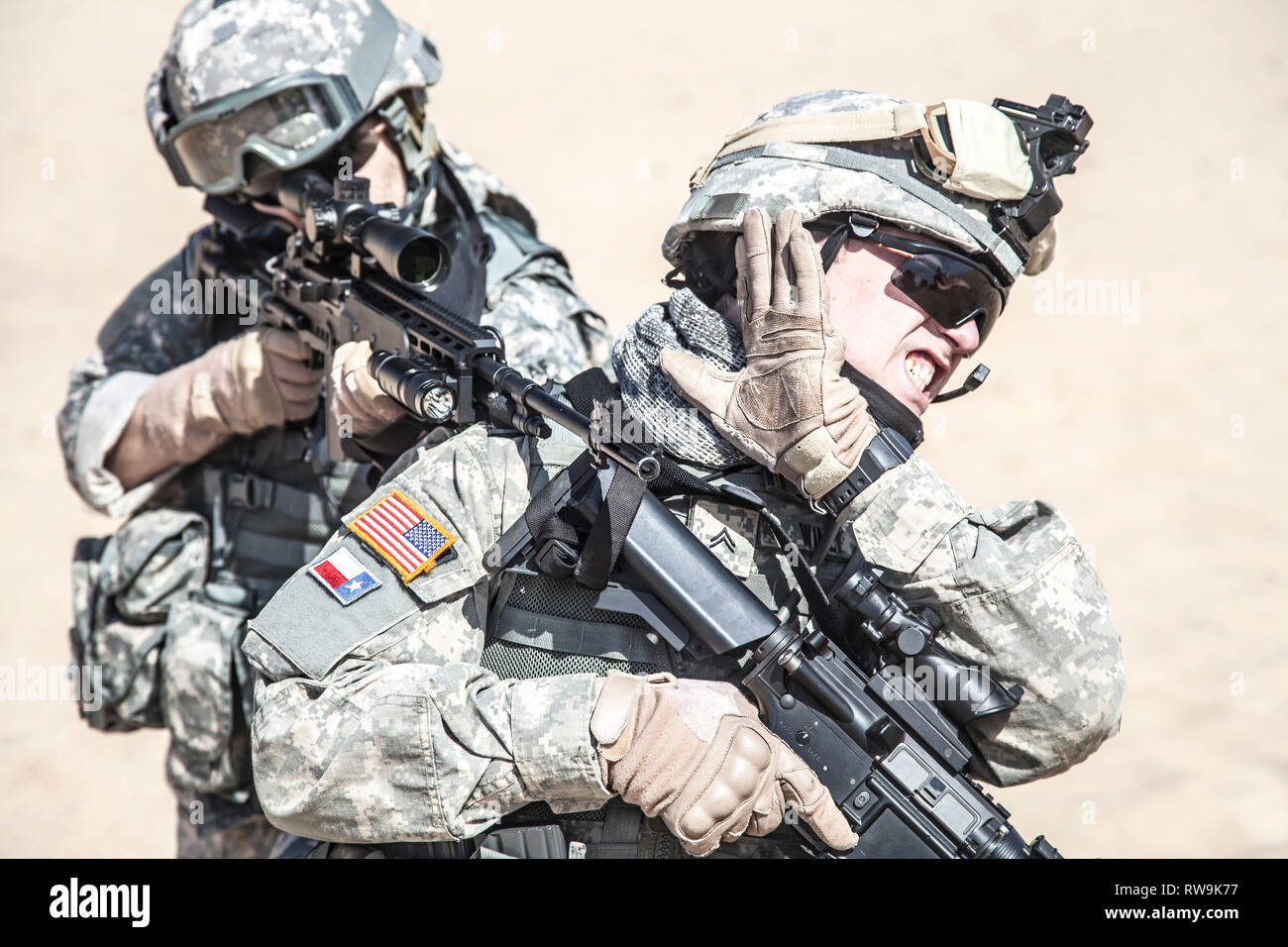 Team of United States airborne infantry men, shooting from shoulder. Stock Photo