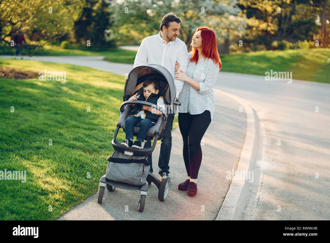 cute family in a sunny park Stock Photo - Alamy