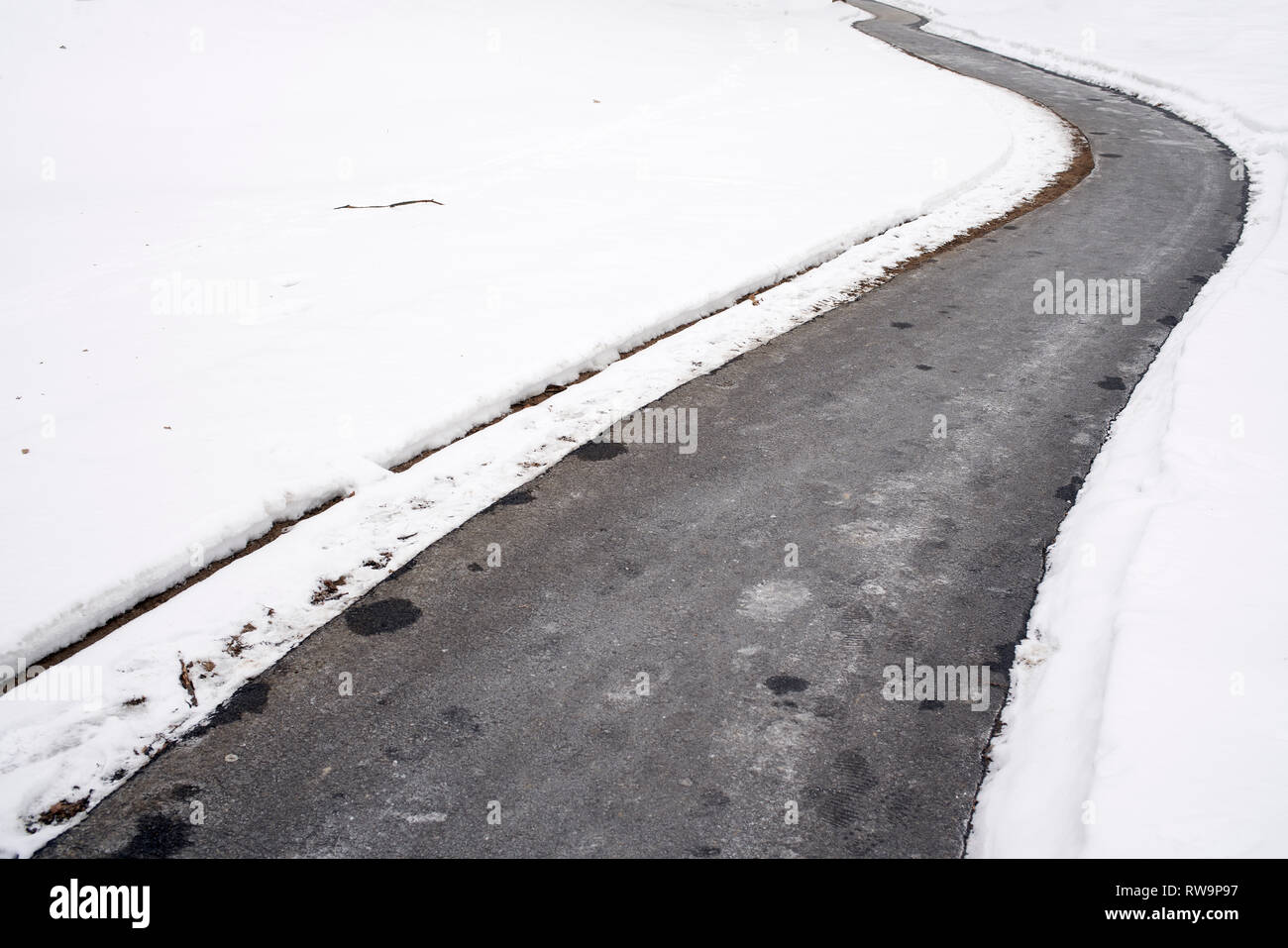 Walkway zigzagging through snow Stock Photo