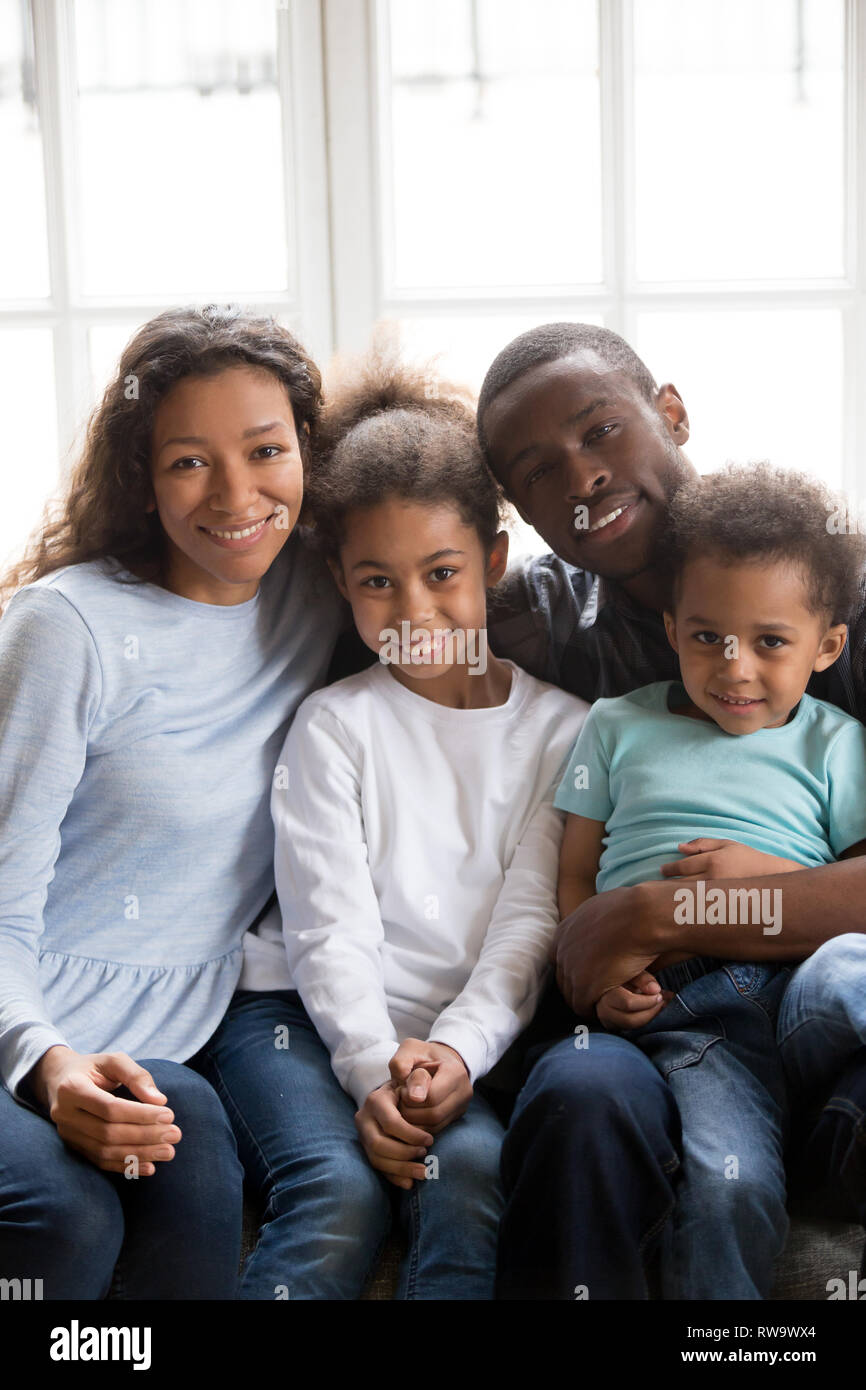 Portrait of young black family with kids relax on couch Stock Photo - Alamy
