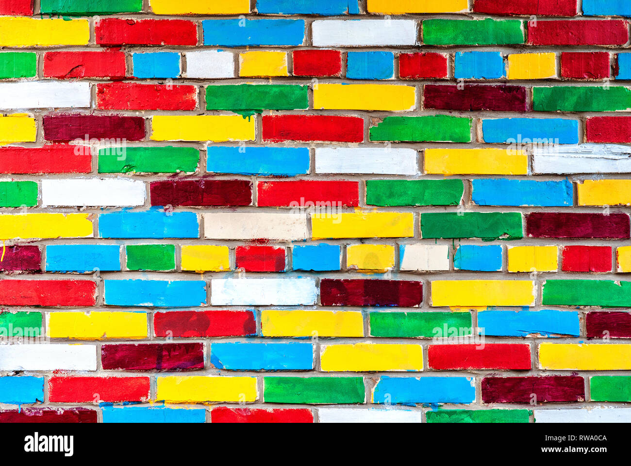 Colored brick wall from multicolored bricks as a creative background ...