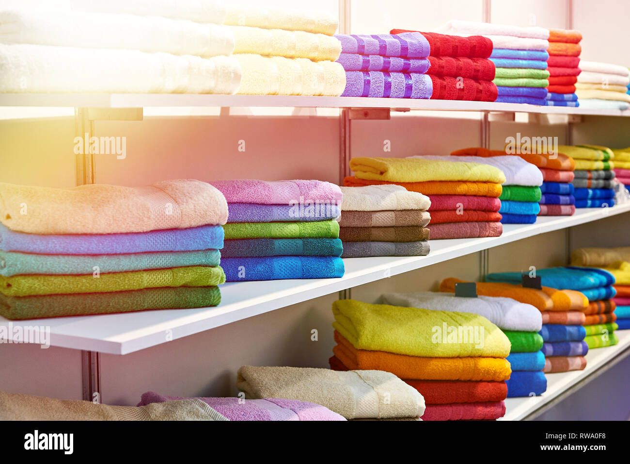 Colored terry towels on store shelves Stock Photo
