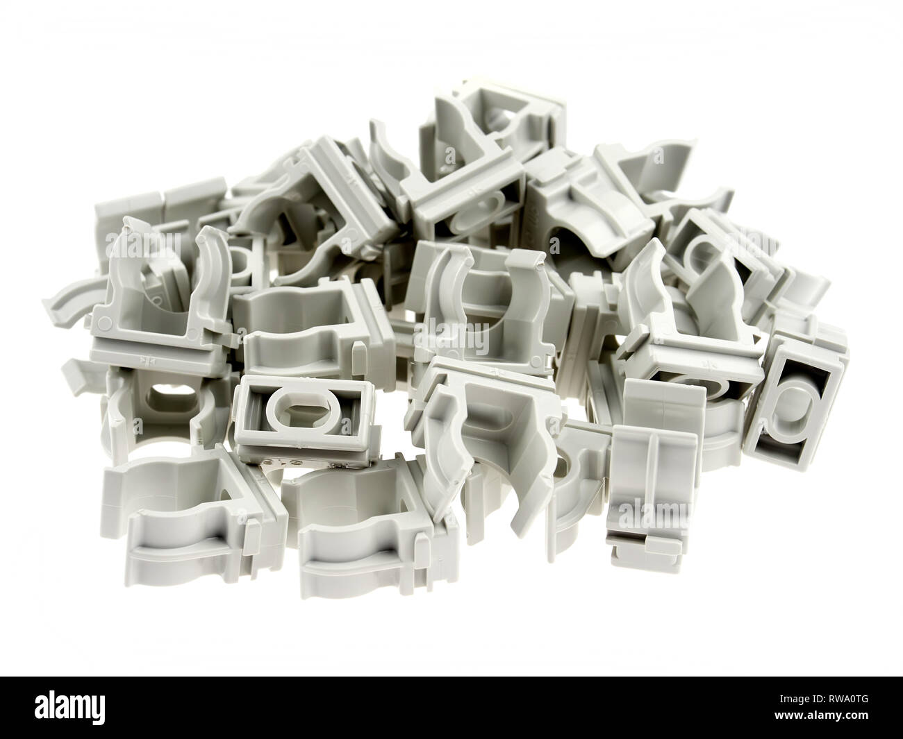 Plastic clamps for electrical tubing, isolated on white Stock Photo Alamy