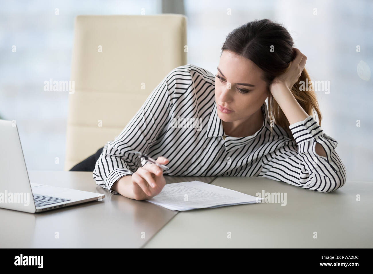 Bored secretary feeling lack of motivation tired of boring job Stock
