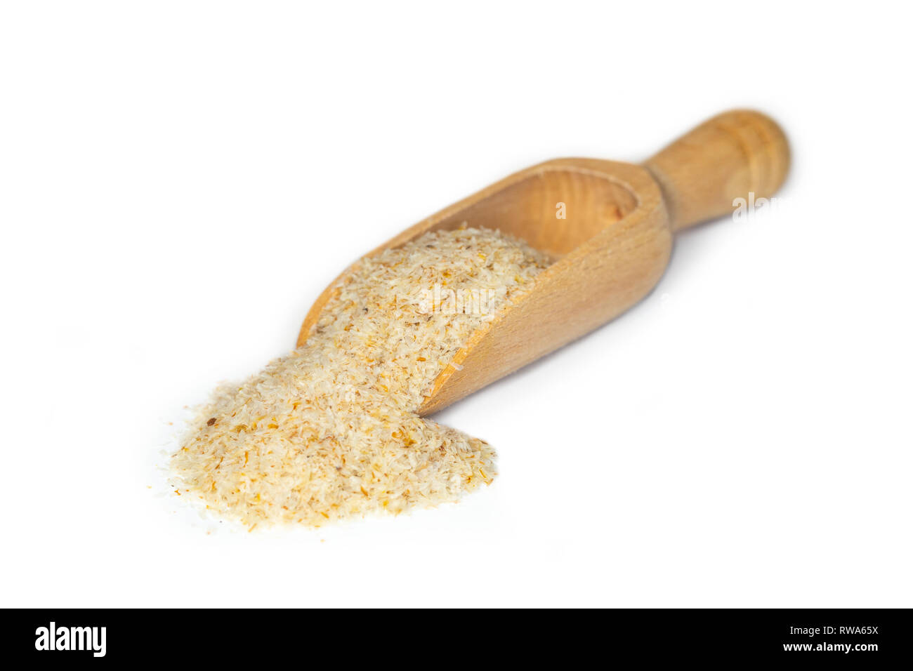 Closeup of grounded psyllium or plantago ovata presented on a small wooden scoop Stock Photo