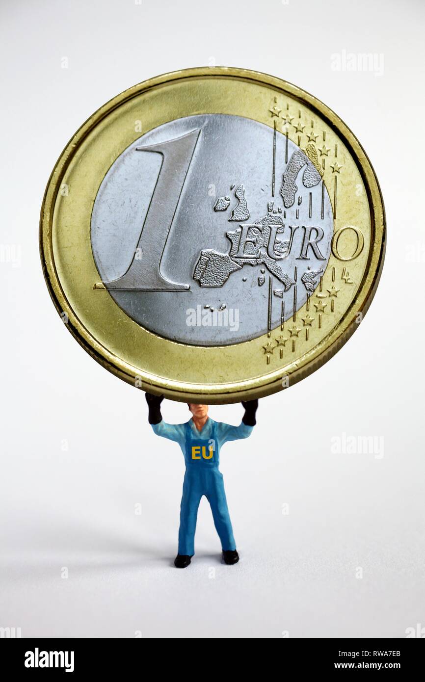 Man holds euro up, eurozone lifts euro, Germany Stock Photo
