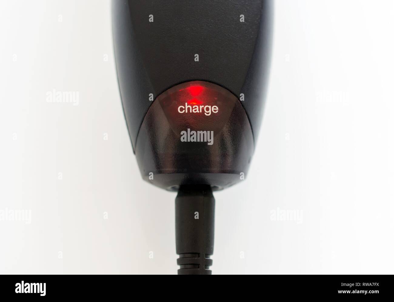 Electrical device is charging, glows red, Germany Stock Photo