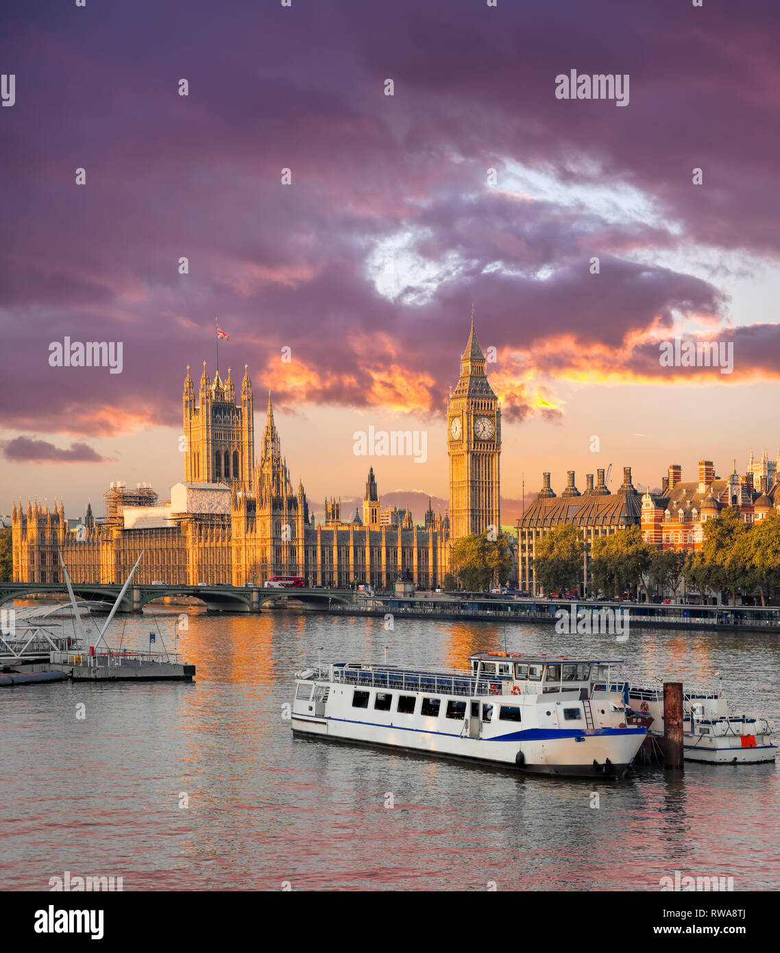 Big Ben and Houses of Parliament with boat in London, England, UK Stock Photo