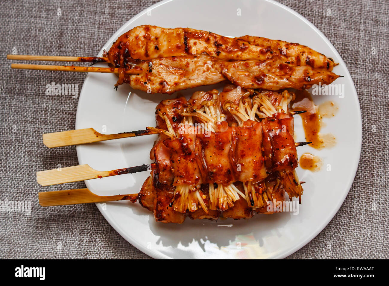 Mala is Grilled meat (Beef, Pork, Chickens or Mushroom) with chilli sauce and chinese hot spicy herb, street food. Stock Photo