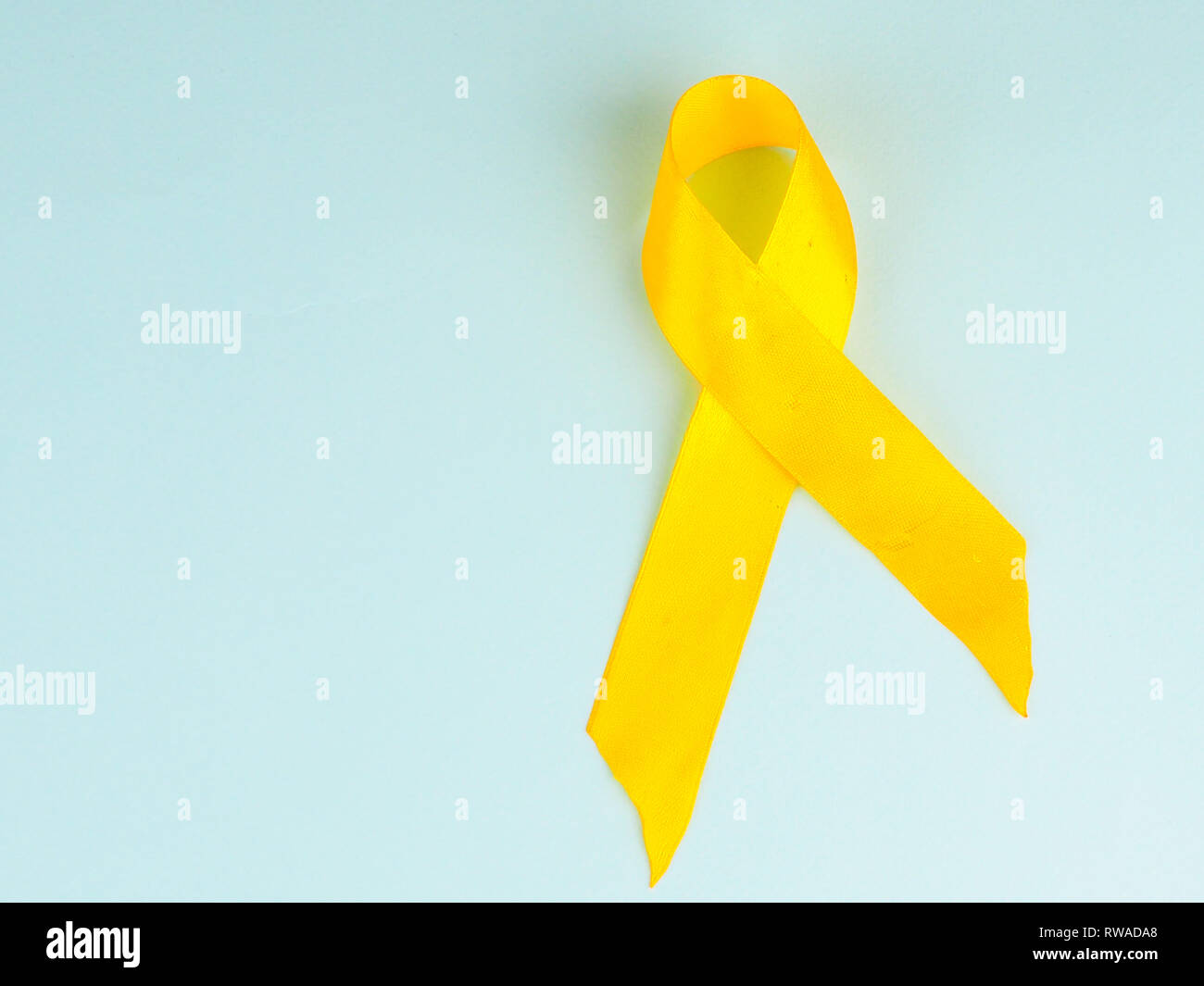 Childhood Cancer Awareness Yellow Ribbon on blue background. Childhood ...