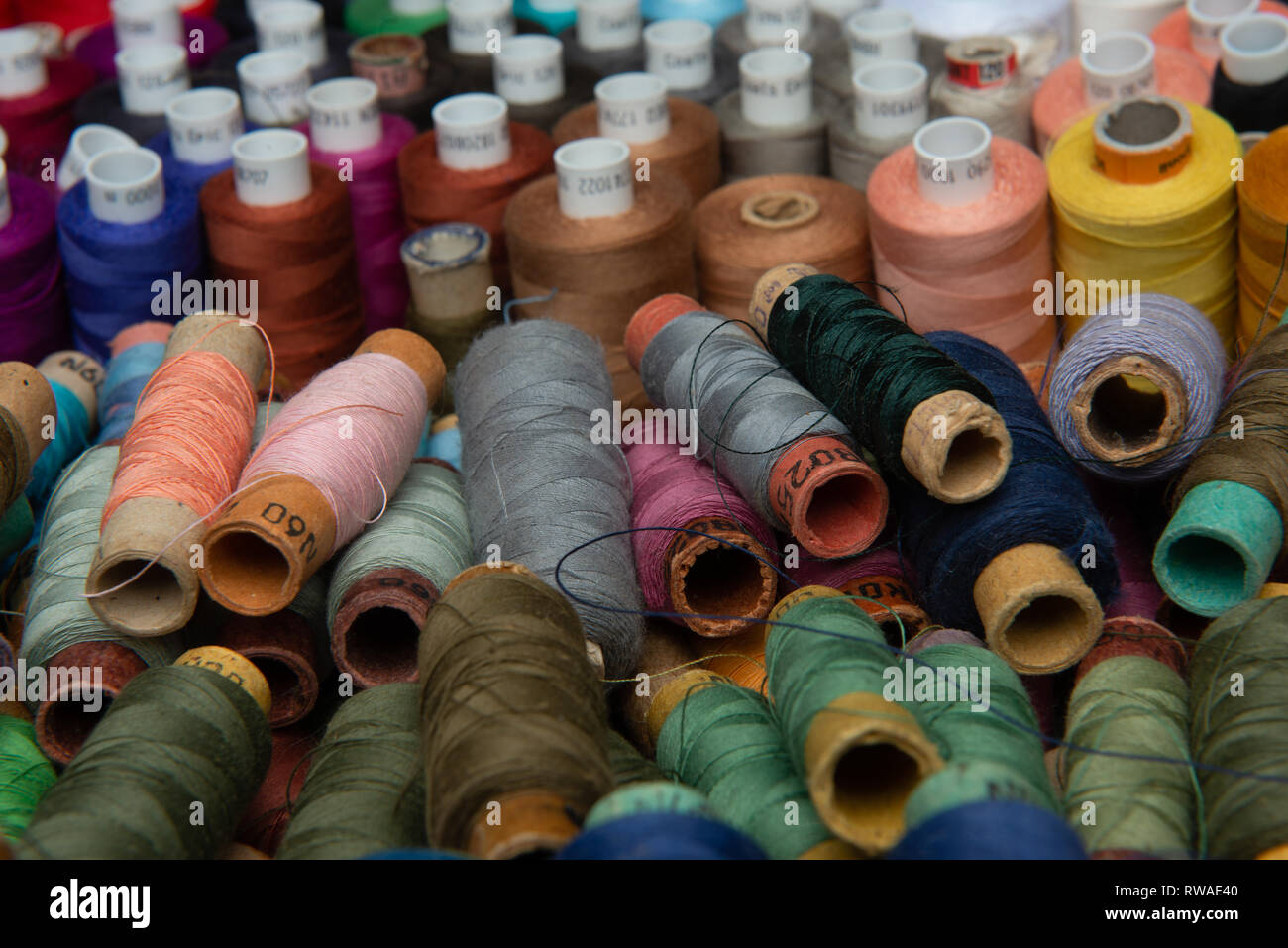 group of multicolored threads top view Stock Photo - Alamy