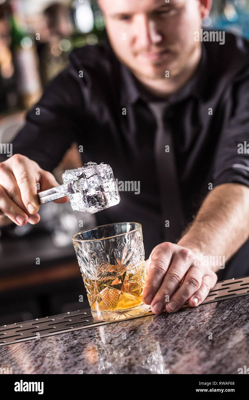 Professional barman making alcoholic cocktail drink old : Professional Old Fashioned Cocktail Bartender