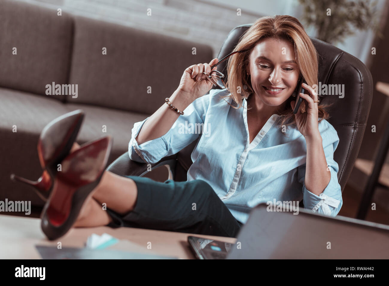 Stylish lawyer wearing high heels enjoying her break from work Stock