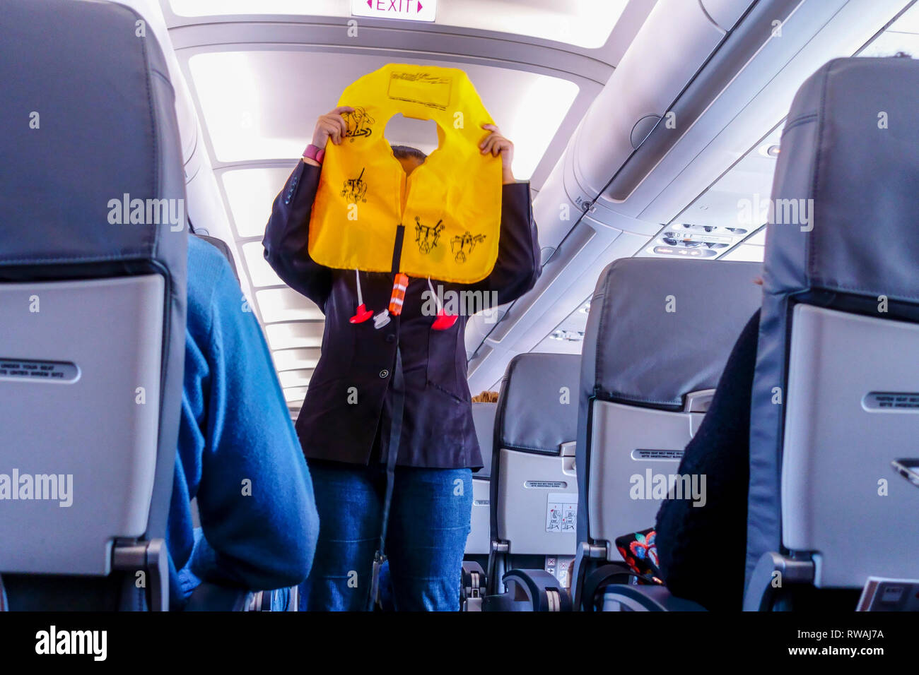 The stewardess on the board plane shows the use of a life jacket, Lauda Air, Airbus A 320 Stock Photo