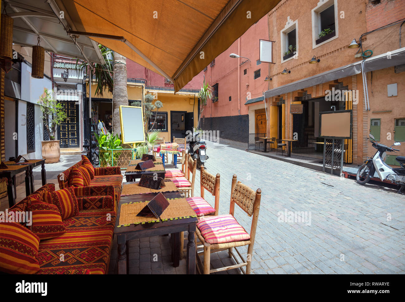 Street with comfortable cafe on market at Medina quarter in Marrakesh, Morocco, North Africa Stock Photo
