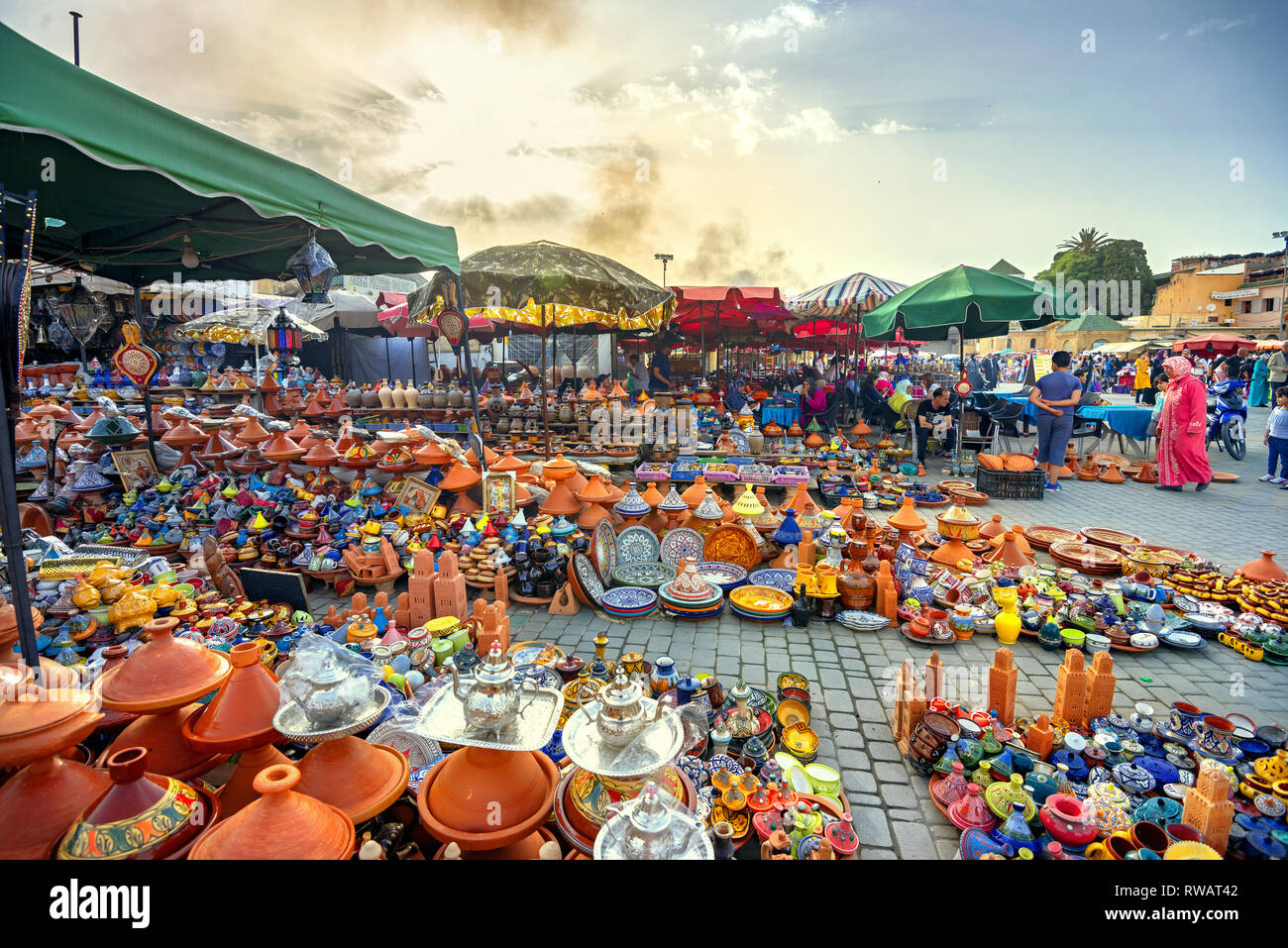 Sale of colorful pottery, traditional ceramic tagines at city market. Meknes, Maghreb, Morocco, North Africa Stock Photo