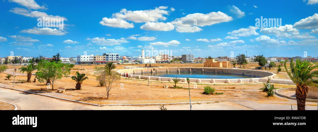 Panoramic landscape  with one of Aghlabid Basins reservoirs, located outside city. Kairouan, Tunisia, North Africa Stock Photo