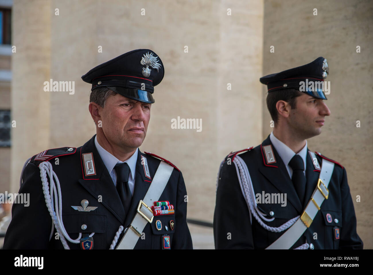 Rome - June 18, 2014 : Two italian police officer is standing on the street. The Carabinieri stand on the streets of Rome. Stock Photo