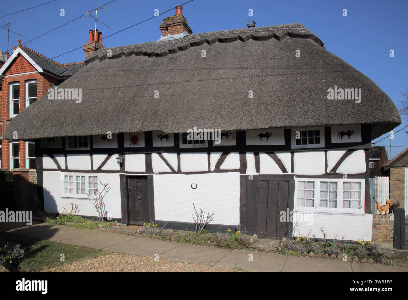 thatched cottages in the large village of henfield in west sussex Stock Photo