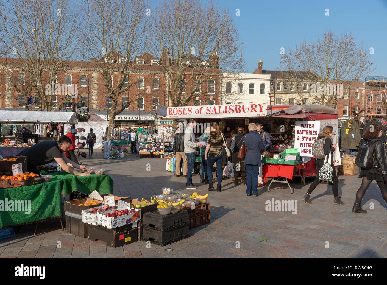 Salisbury, Wiltshire, England, UK. March 2019.  Stalls and customers on market day on the Market Place in the city centre Stock Photo