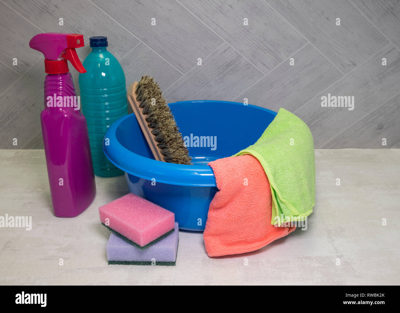 blue washing up dish with cleaning tools and detergents as degreaser