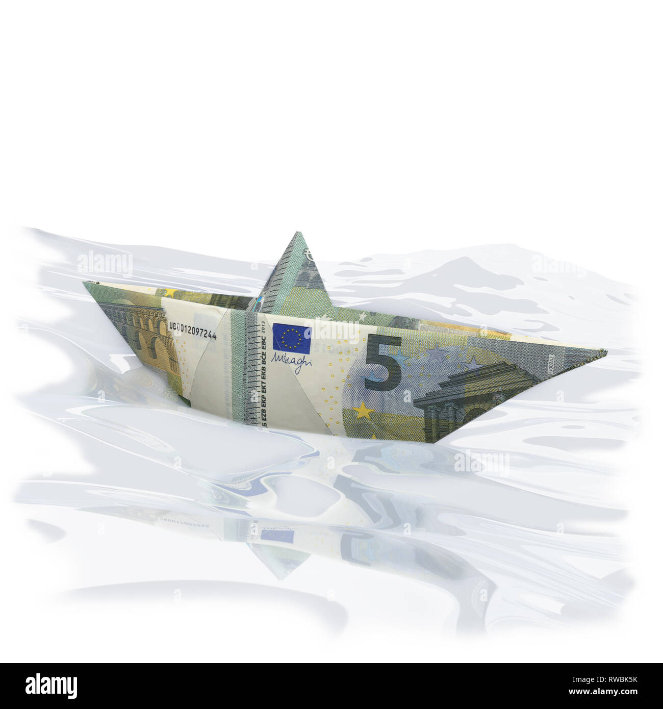 Little paper boat with five Euro on the ocean Stock Photo