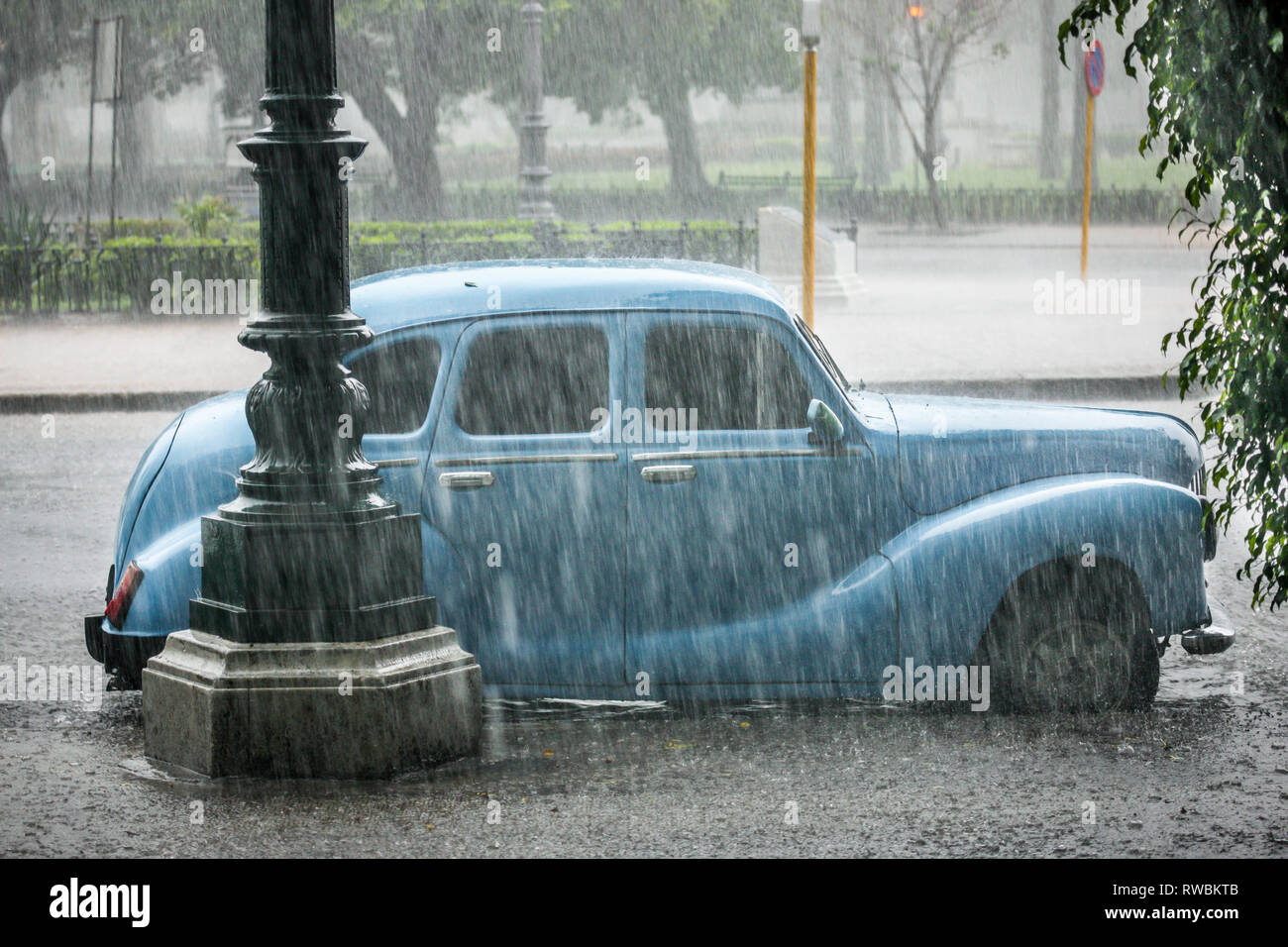 Havana, Cuba. 28th May, 2009. A four door Ford Prefect parked on a street during a thunderstorm in Havana, Cuba. Stock Photo