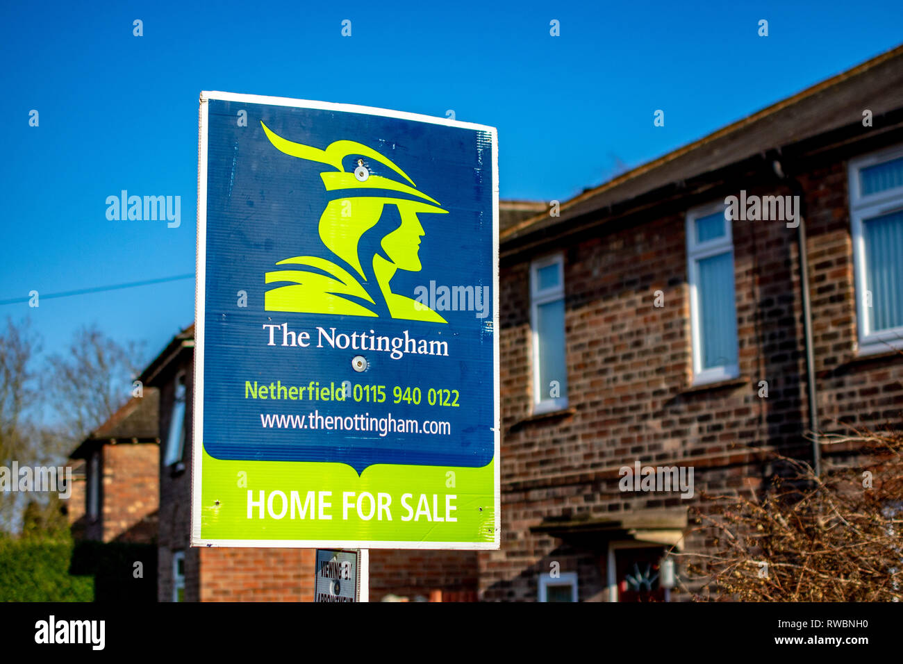 Nottingham, England, United Kingdom - 23/03/2019: estate agents The Nottingham sign showing the availability of a property for sale. Blue and Green. Stock Photo
