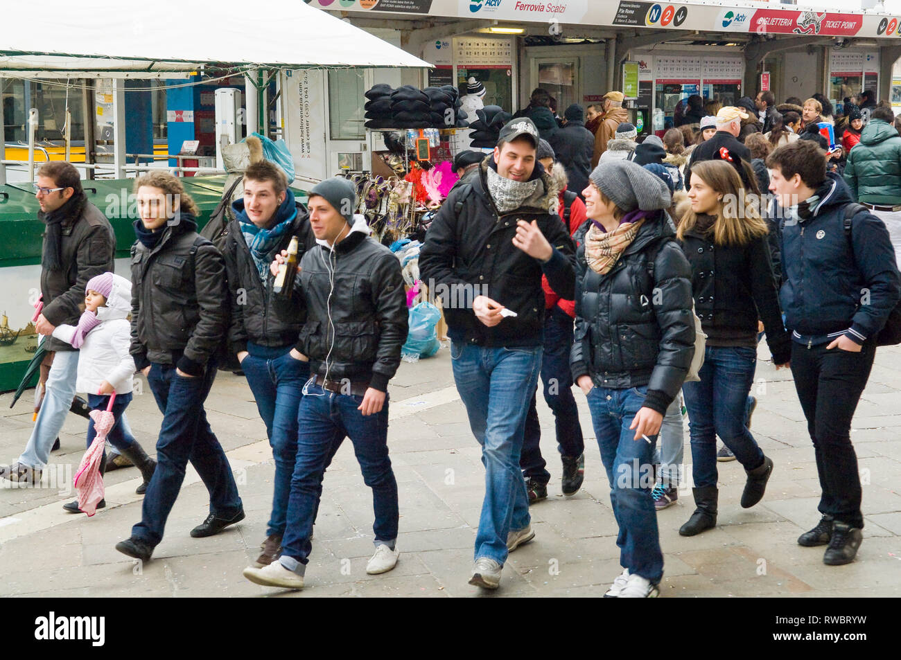 Groups of people walking around during carnival weekend in Venice, Italy Stock Photo