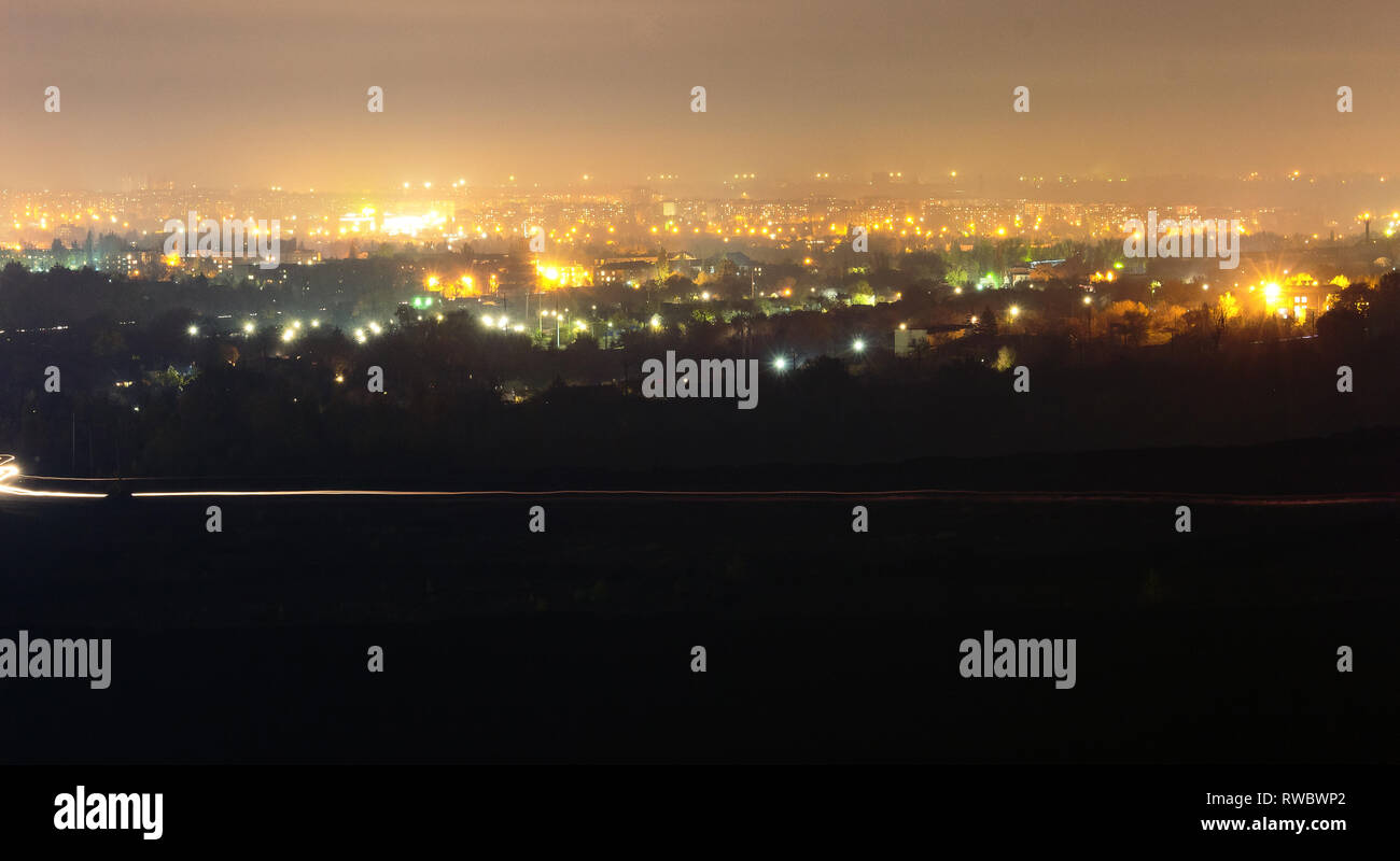 Night city landscape in Krivoy Rog, Ukraine. Bright city lights at the dark time of the day Stock Photo