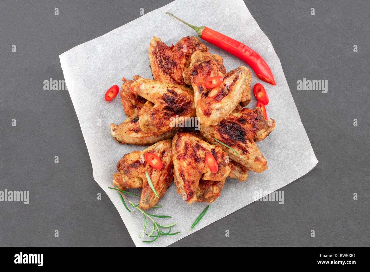 Baked chicken wings with sauce. Food background. Top view Stock Photo