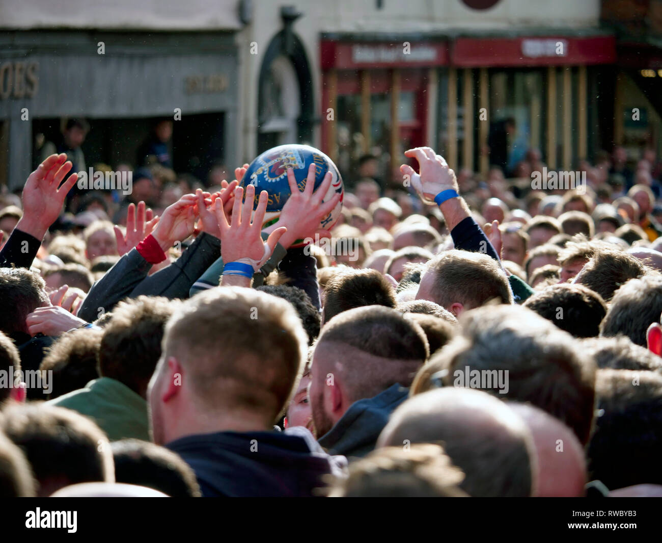 Ashbourne Derbyshire, UK. 5th Mar, 2019. Ashbourne Royal Shrovetide Football match on Shrove Tuesday. Ye Olde & Ancient Medieval hugball game is the forerunner to football. It's played between two teams, the Up'Ards & Down'Ards separated by the Henmore Brook river. The goals are 3 miles apart at Sturston Mill & Clifton Mill. Charles Cotton's poem Burlesque upon the Great Frost, dating from 1683, mentions this game at Ashbourne. He was the cousin of Aston Cockayne Baronet of Ashbourne, Derbyshire. Credit: Doug Blane/Alamy Live News Stock Photo