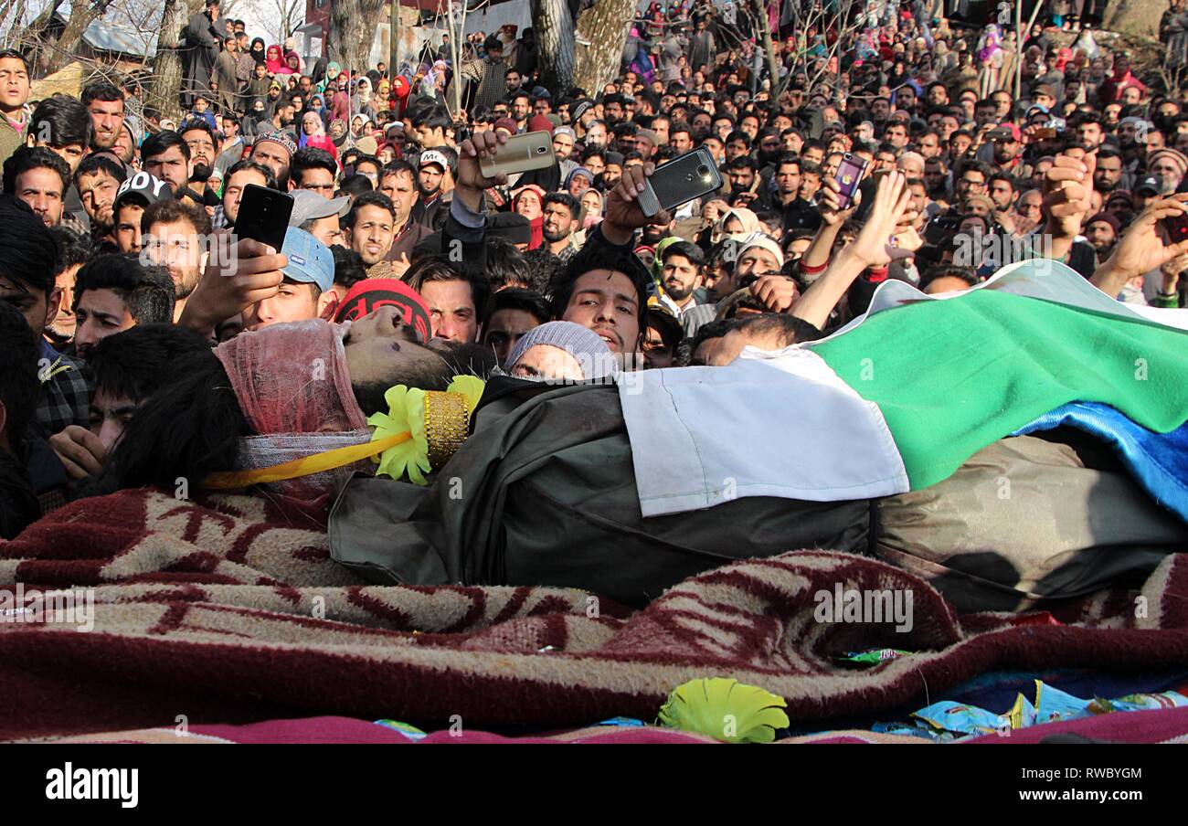 March 5, 2019 - Tral, Jammu and Kashmir, India - Dead body of a local militant Irfan Ahmad Rather is being carried by villagers in his native village Sharief Abad area of Tral some 45 kilometers from Srinagar, Kashmir on March 05, 2019.Indian security forces killed two militants when the gun-battle broke out between militants and government forces in Reshipora area of Tral in south Kashmir. (Credit Image: © Faisal KhanZUMA Wire) Stock Photo