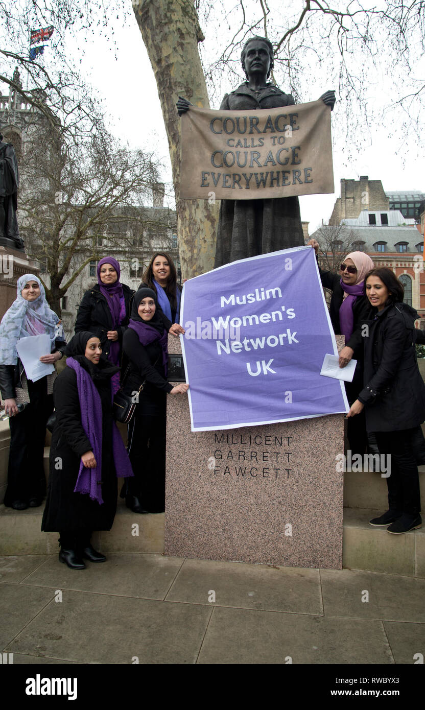 London, UK. 05th Mar, 2019. Parliament Square, Westminster, London. Ahead of International Women's Day, a group of women from the Muslim Women's Network UK pose in front of the statue of suffragette Millicent Garrett Fawcett Credit: Jenny Matthews/Alamy Live News Stock Photo