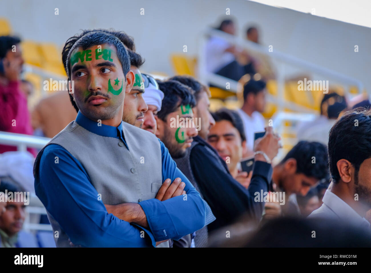 Abu Dhabi, UAE. 5th Mar 2019. Pakistan Super League 2019/ Sad Fans of Lahore Qalandars Face Painted with Pakistani Flag at Sheikh Zayed Cricket Stadium Abu Dhabi. Credit: Fahd Khan/Alamy Live News Stock Photo