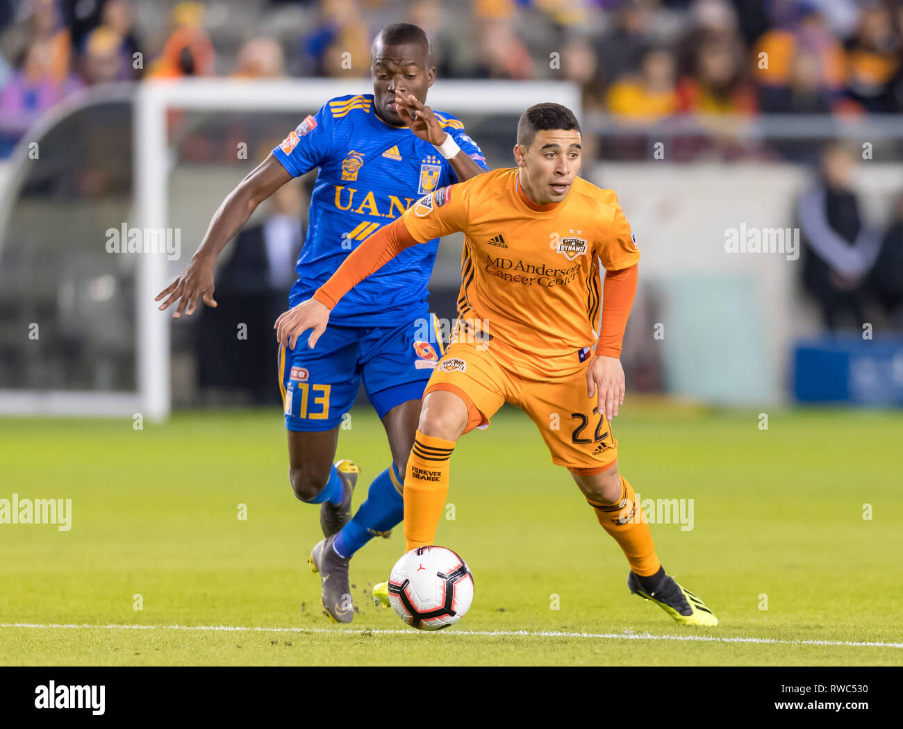 Houston, Texas, USA. 05th Mar, 2019. February 26, 2019: Houston Dynamo midfielder Matias Vera (22) and UANL Tigres forward Enner Valencia (13) battle for the ball during the CONCACAF Champions League quarter finals game 18 leg 1 between UANL Tigres and Houston Dynamo at BBVA Compass Stadium in Houston, Texas The score at the half 0-0 © Maria Lysaker/CSM. Credit: Cal Sport Media/Alamy Live News Stock Photo