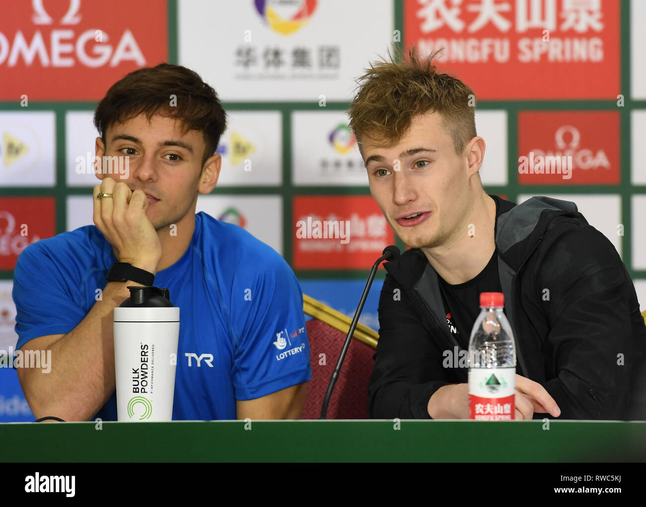 Beijing, China. 6th Mar, 2019. British divers Tom Daley (L) and Jack Laugher attend the press conference prior to the FINA Diving World Series 2019 in Beijing, capital of China, on March 6, 2019. The competitions of FINA Diving World Series will be held from March 7 to 9 in Beijing. Credit: Kong Hui/Xinhua/Alamy Live News Stock Photo