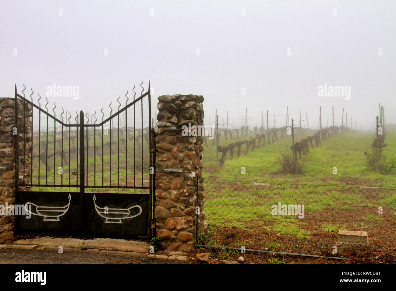 The gates to the vineyard at Golan Heights Winery in Katzrin Israel display the oil lamp logo of the winery. Stock Photo