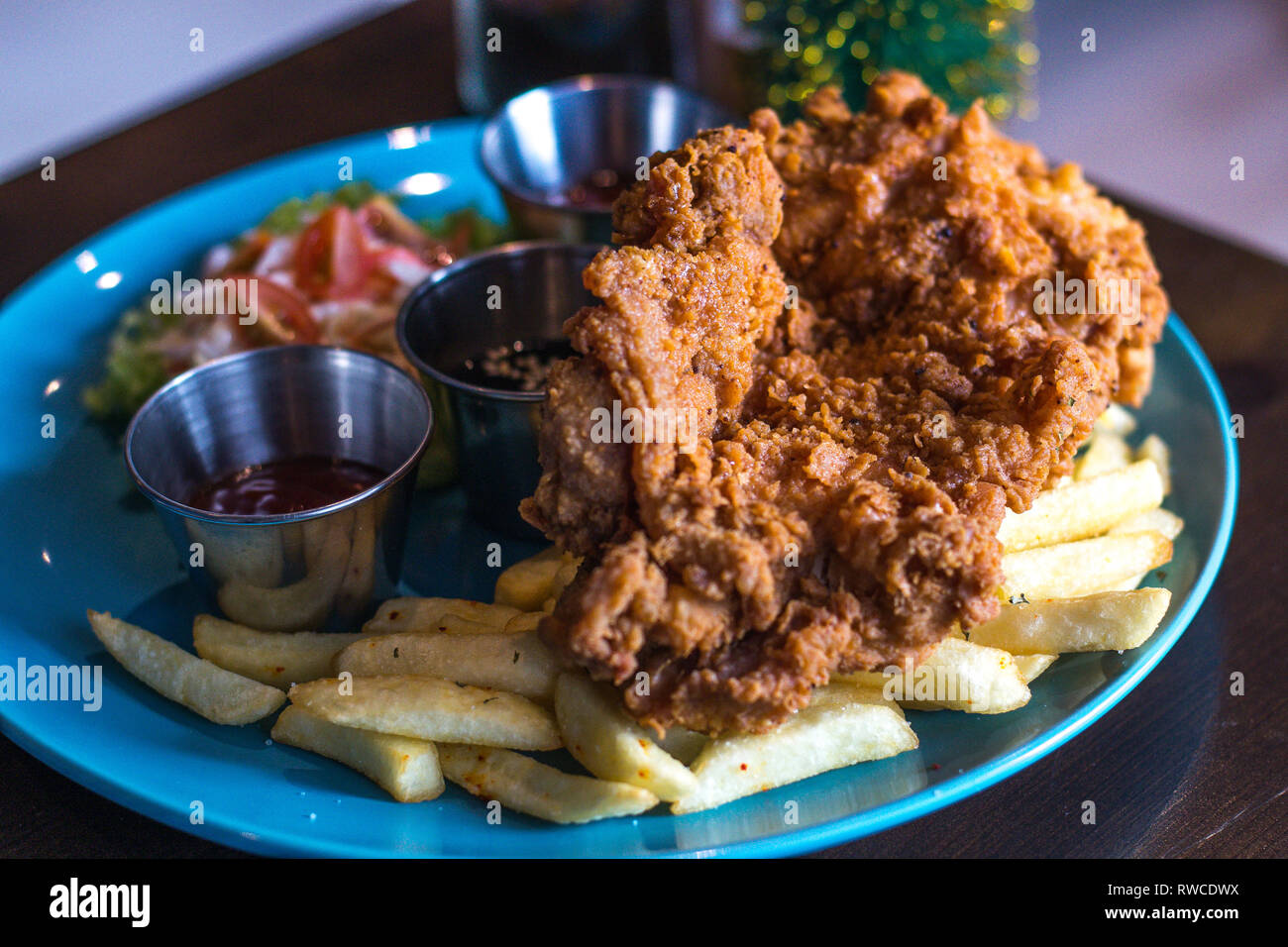 Chicken Chop Garlic Soy Sauce with french fries and coleslaw Stock