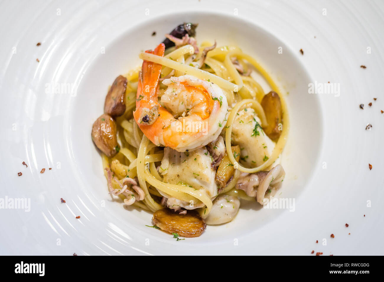 Frutti di Mare Linguine with assorted seafood in choice of Aglio Olio style Stock Photo