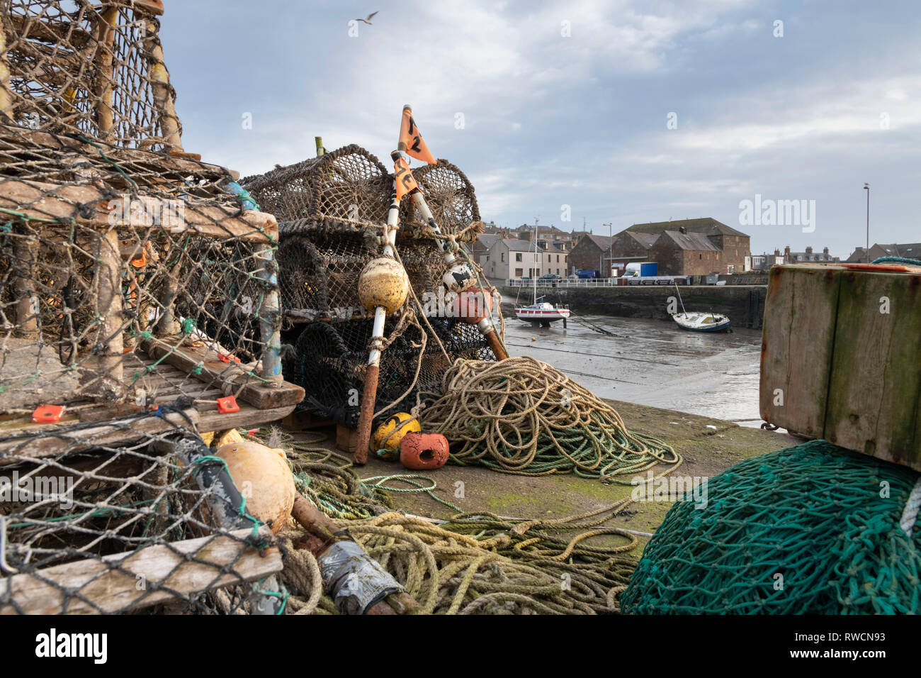 Fishing Equipment Stacked on the Quayside in the Scottish Village of Gourdon Stock Photo